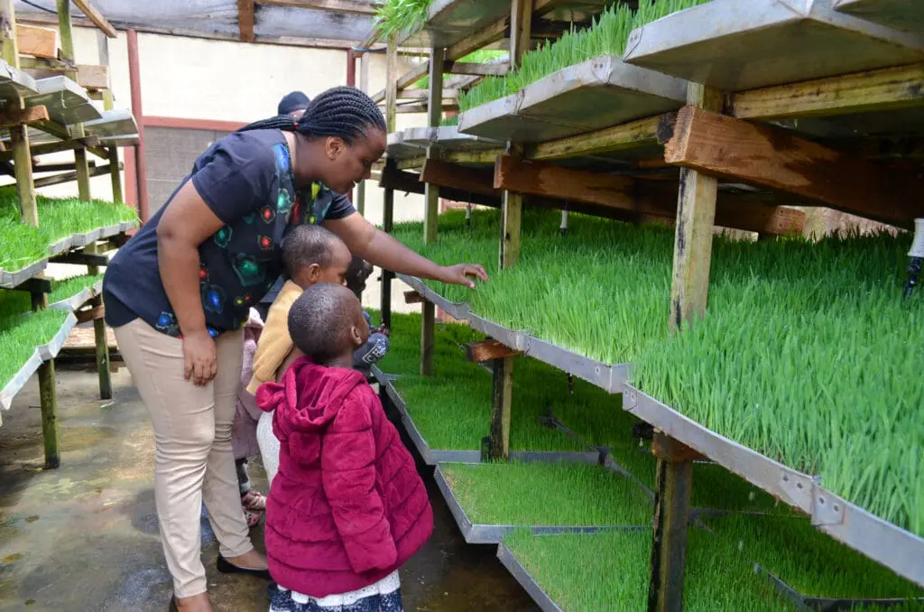 Woman teaching children about plants